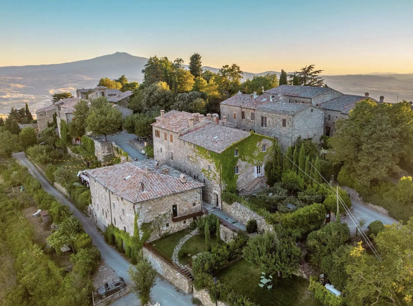 Aerial view of a stone hilltop hamlet in Sarteano, Tuscany, at golden hour
